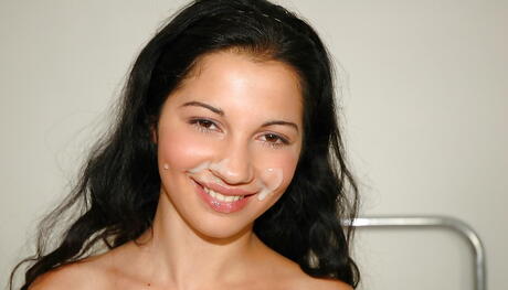 Sylphlike brunette teen Sabreena sucking on black cock and enjoys a facial 