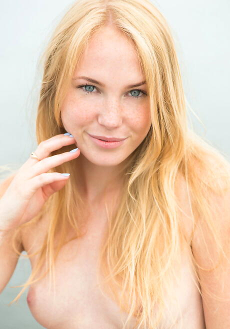 Slim blonde young Runa in shorts in nasty foot fetish at beach