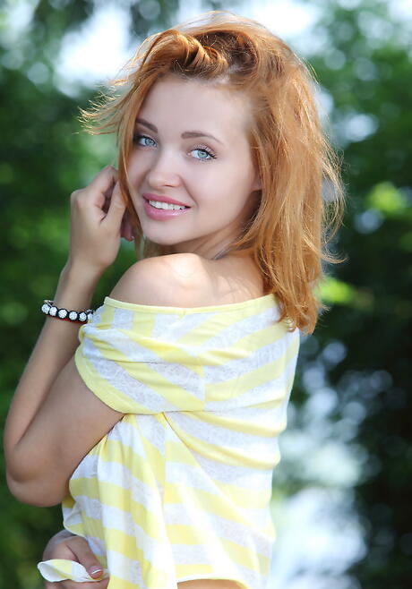 Slim redheaded teen Valeria showing big boobs and spreading her legs outdoor